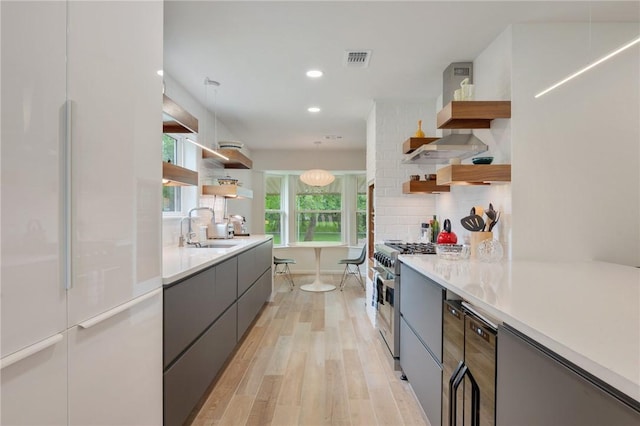 1003 Guadalupe Dr, College Station, TX 77840 - kitchen featuring open shelves, high end stainless steel range, white fridge, modern cabinets, and recessed lighting