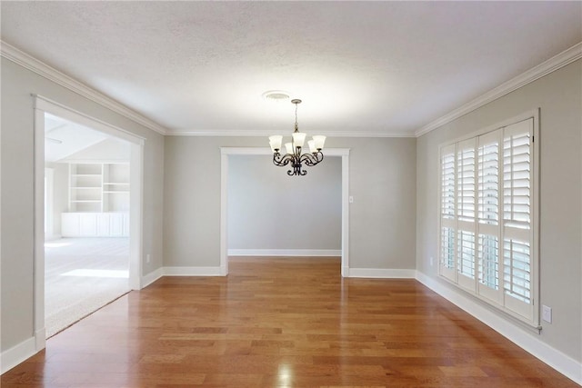 unfurnished dining area with baseboards, ornamental molding, and light wood-style floors