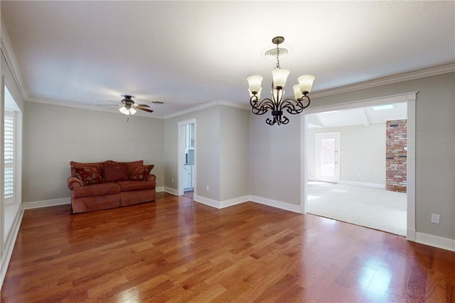 living area with baseboards, crown molding, and light wood finished floors