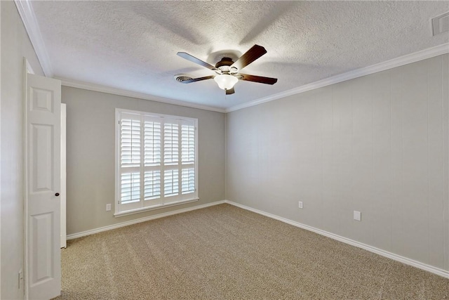 carpeted empty room featuring a ceiling fan, crown molding, and a textured ceiling