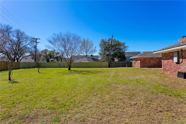 view of yard featuring a fenced backyard