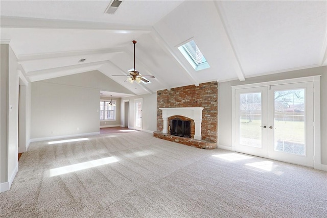 unfurnished living room featuring lofted ceiling with beams, a brick fireplace, baseboards, and carpet flooring