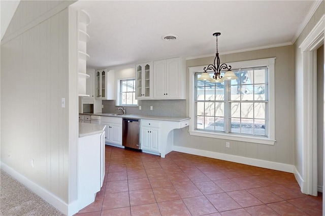 kitchen with light countertops, visible vents, glass insert cabinets, white cabinets, and dishwasher