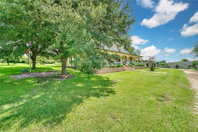 view of yard with a porch