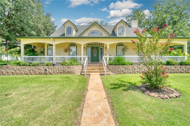 view of front of home with a front yard and a porch