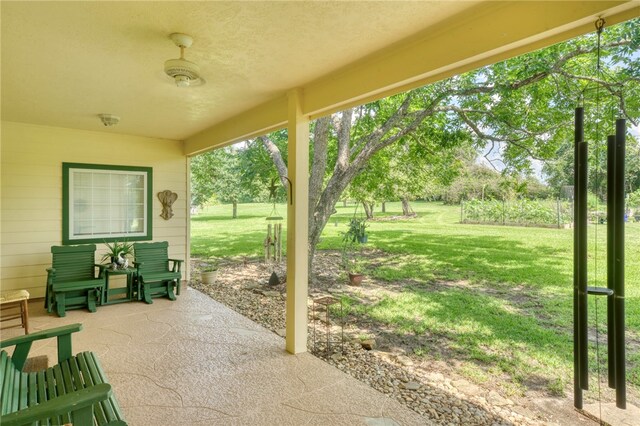 view of patio / terrace featuring ceiling fan