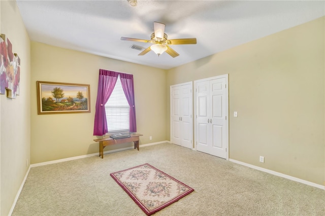 unfurnished bedroom with light carpet and ceiling fan