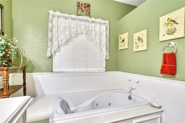 bathroom featuring a washtub