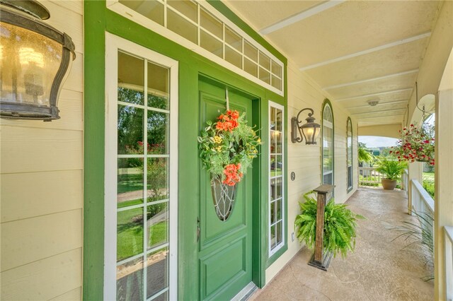 property entrance featuring covered porch