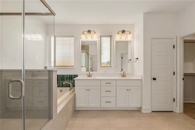 3568 Chantilly Path, Bryan, TX 77808 - bathroom featuring double vanity, a garden tub, a stall shower, and tile patterned floors