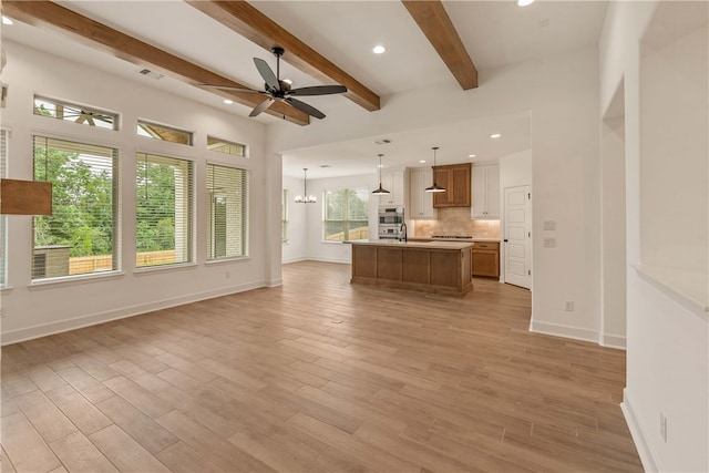 3568 Chantilly Path, Bryan, TX 77808 - unfurnished living room with a ceiling fan, light wood-style flooring, beam ceiling, a chandelier, and recessed lighting