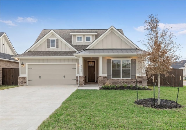 craftsman-style house featuring a garage and a front lawn