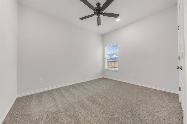 carpeted empty room featuring ceiling fan