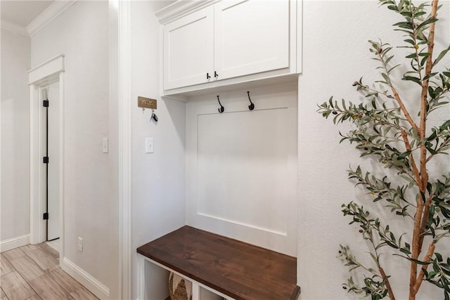 4209 Harding Ct, Bryan, TX 77802 - mudroom featuring crown molding, baseboards, and light wood finished floors