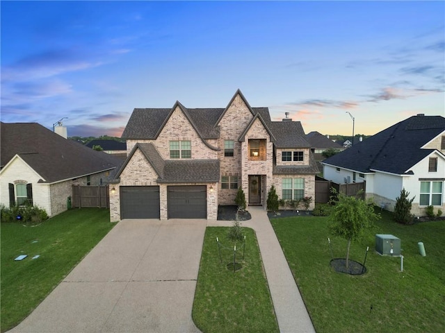 4209 Harding Ct, Bryan, TX 77802 - french country inspired facade with driveway, stone siding, and an attached garage