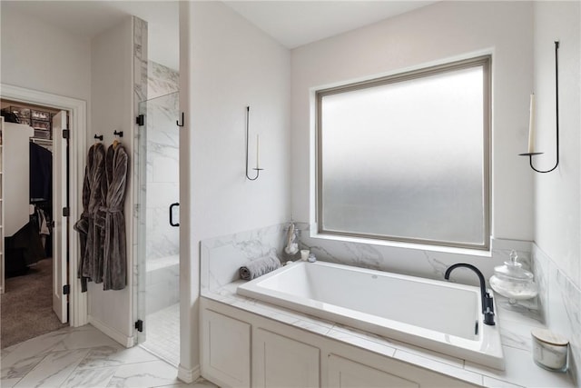4209 Harding Ct, Bryan, TX 77802 - full bath with marble finish floors, a marble finish shower, a garden tub, and a walk in closet