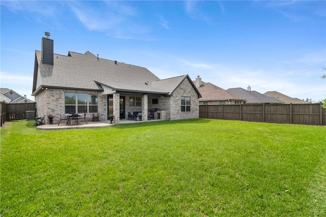 4209 Harding Ct, Bryan, TX 77802 - back of house featuring a chimney, a patio, brick siding, and a shingled roof