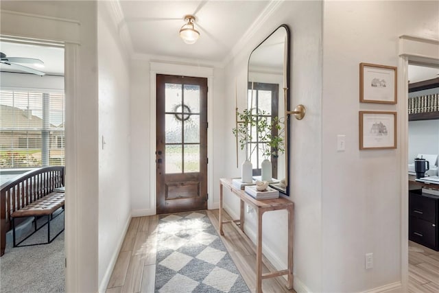 4209 Harding Ct, Bryan, TX 77802 - entryway featuring crown molding, baseboards, light wood-type flooring, and ceiling fan