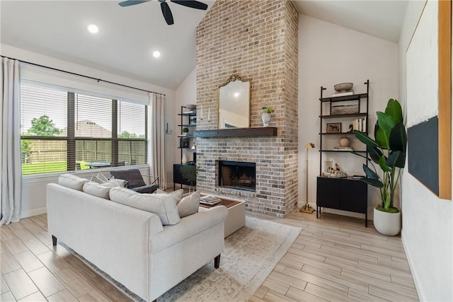 4209 Harding Ct, Bryan, TX 77802 - living area with ceiling fan, a brick fireplace, high vaulted ceiling, baseboards, and wood finished floors