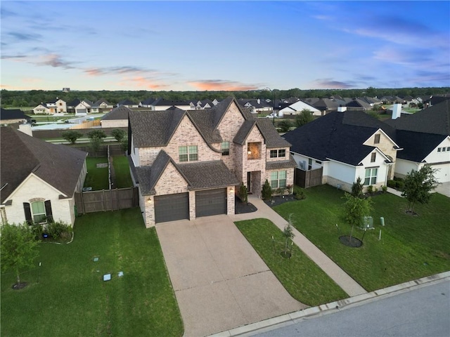 4209 Harding Ct, Bryan, TX 77802 - view of front of property with stone siding, a residential view, driveway, and a garage