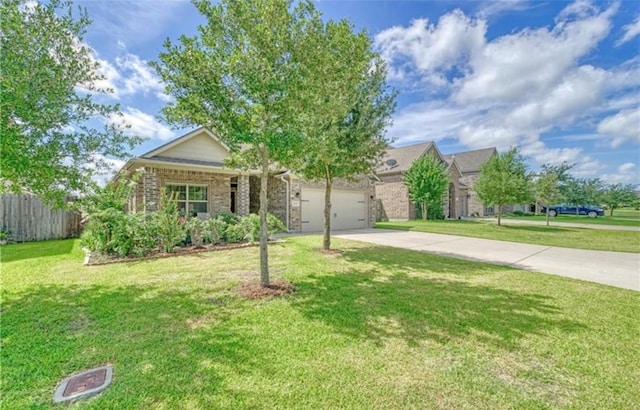 view of front of property featuring an attached garage, fence, concrete driveway, and a front yard