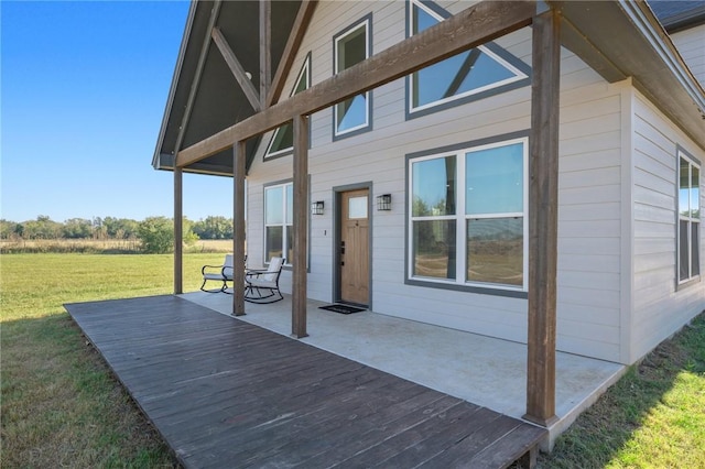 wooden deck with a yard