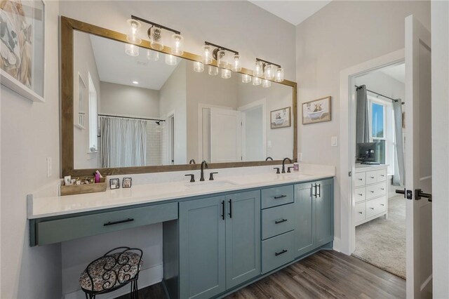 bathroom featuring hardwood / wood-style floors and vanity