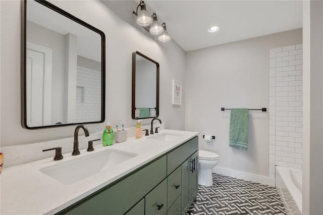 bathroom featuring tile patterned floors, vanity, and toilet