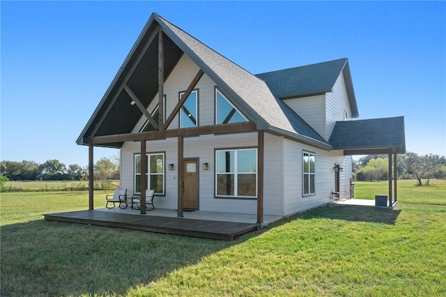 rear view of house with a yard