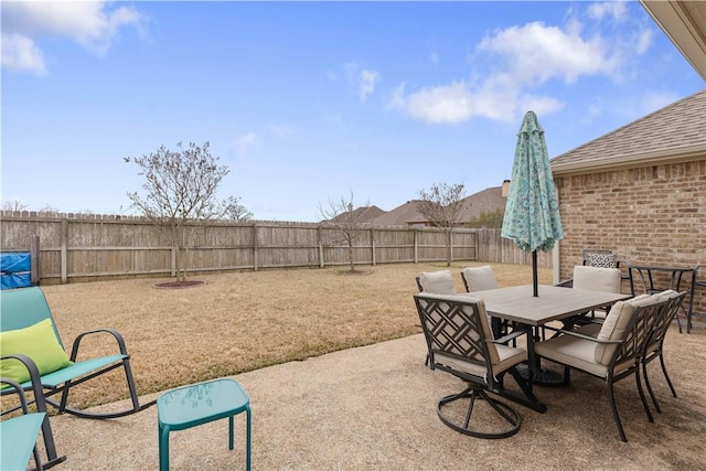 view of patio featuring outdoor dining space and a fenced backyard