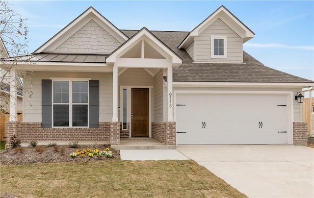 craftsman inspired home featuring a standing seam roof, metal roof, concrete driveway, a garage, and brick siding