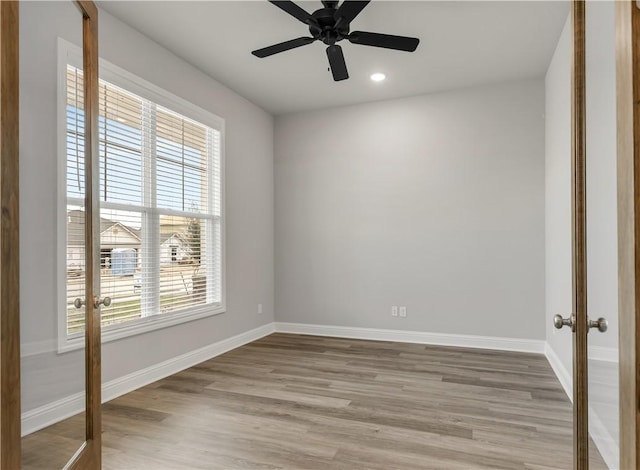 unfurnished bedroom featuring light wood-style flooring, recessed lighting, french doors, baseboards, and ceiling fan