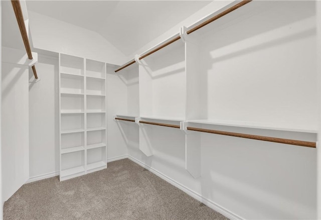 spacious closet with carpet floors and lofted ceiling