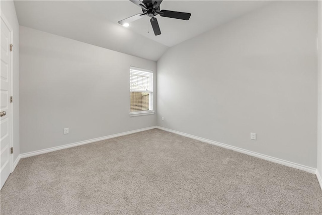 unfurnished room featuring lofted ceiling, carpet flooring, baseboards, and ceiling fan