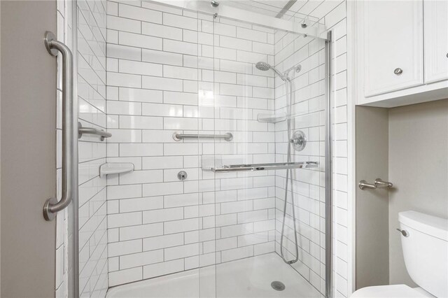 2909 River Oaks Cir, Bryan, TX 77802 - full bathroom with a shower stall and toilet
