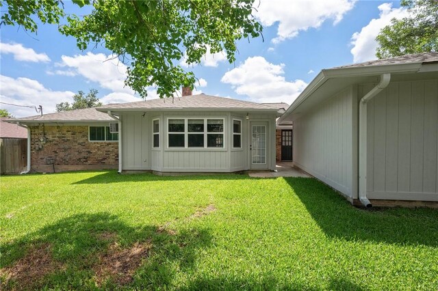 2909 River Oaks Cir, Bryan, TX 77802 - rear view of house with a chimney