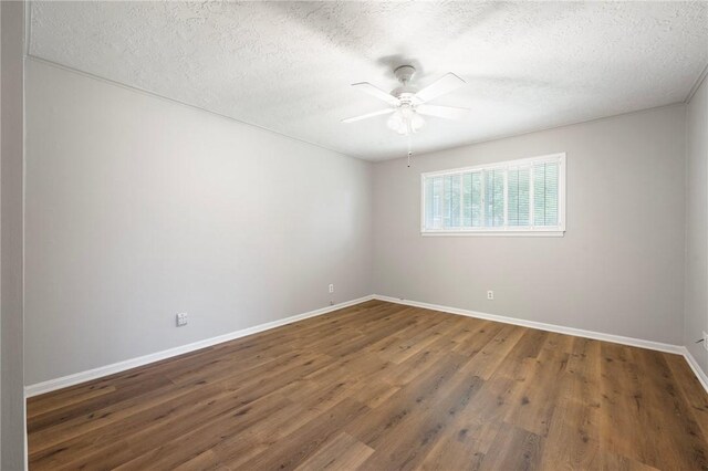 2909 River Oaks Cir, Bryan, TX 77802 - unfurnished room with a textured ceiling, a ceiling fan, baseboards, and wood finished floors