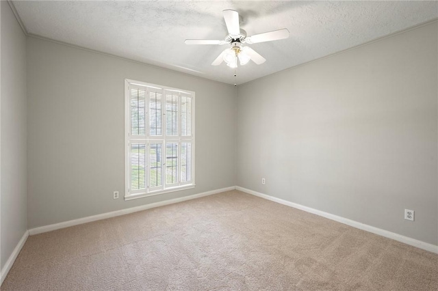 2909 River Oaks Cir, Bryan, TX 77802 - carpeted empty room featuring baseboards, a textured ceiling, and a ceiling fan