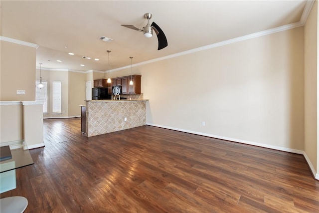 unfurnished living room with crown molding, dark hardwood / wood-style floors, and ceiling fan