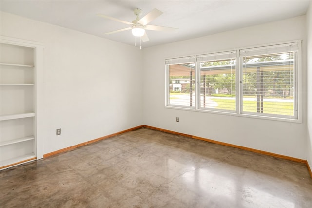 304 Crescent Dr, Bryan, TX 77801 - empty room with baseboards, a ceiling fan, and built in features