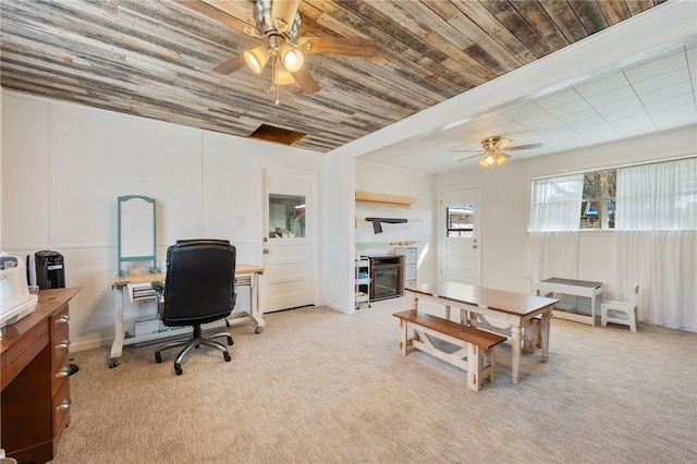 office featuring ceiling fan and light colored carpet