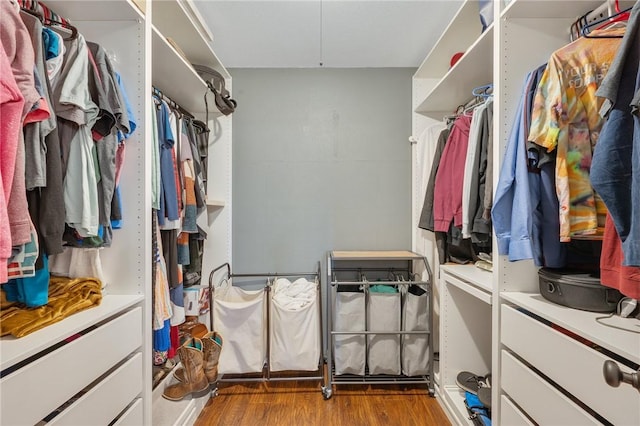 walk in closet featuring light hardwood / wood-style floors