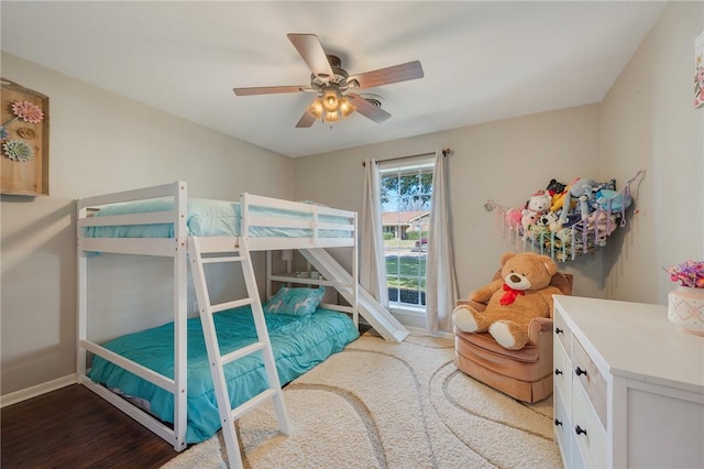 bedroom with ceiling fan and hardwood / wood-style floors