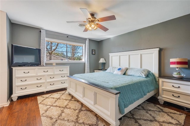 bedroom featuring ceiling fan and dark hardwood / wood-style flooring