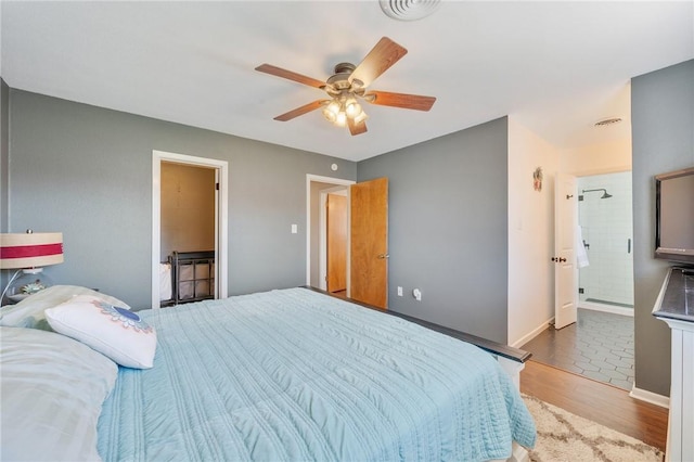 bedroom featuring dark hardwood / wood-style flooring and ceiling fan