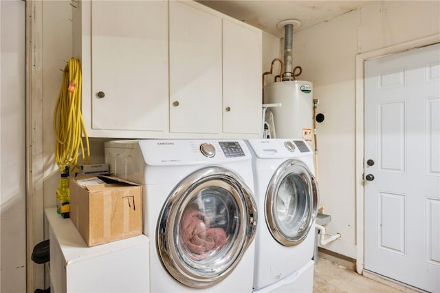 laundry area featuring cabinets, water heater, and independent washer and dryer