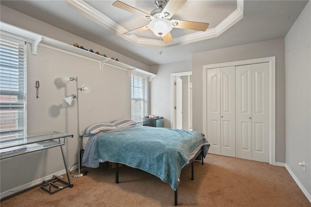 3701 Essen Loop, College Station, TX 77845 - bedroom featuring a raised ceiling, carpet flooring, a closet, ornamental molding, and baseboards