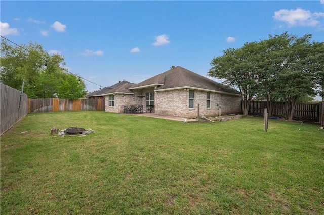3701 Essen Loop, College Station, TX 77845 - back of house with a fire pit, a patio area, and brick siding
