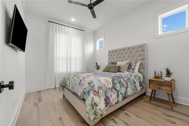 bedroom featuring ornamental molding, light hardwood / wood-style floors, and ceiling fan