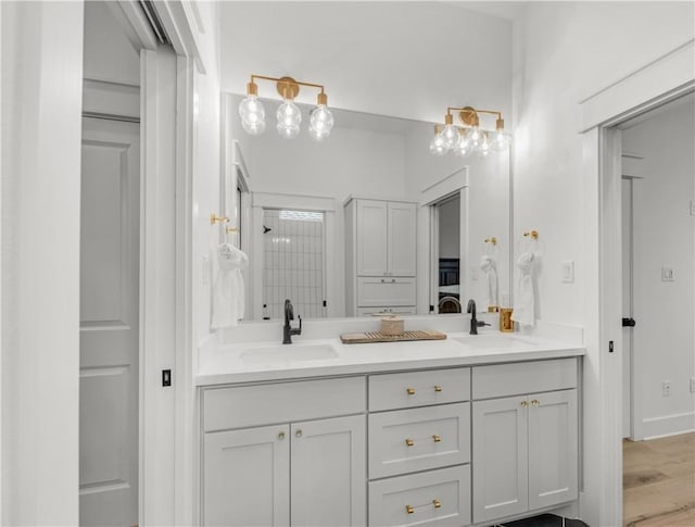 bathroom with vanity and hardwood / wood-style floors